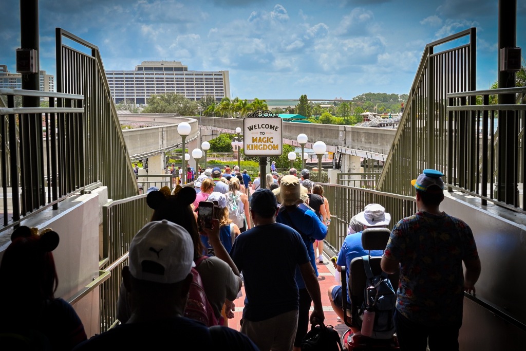 Lake Buena Vista, Florida  USA - 07 31 2024: People walking into the Magic Kingdom park at Disney World from the monorail station