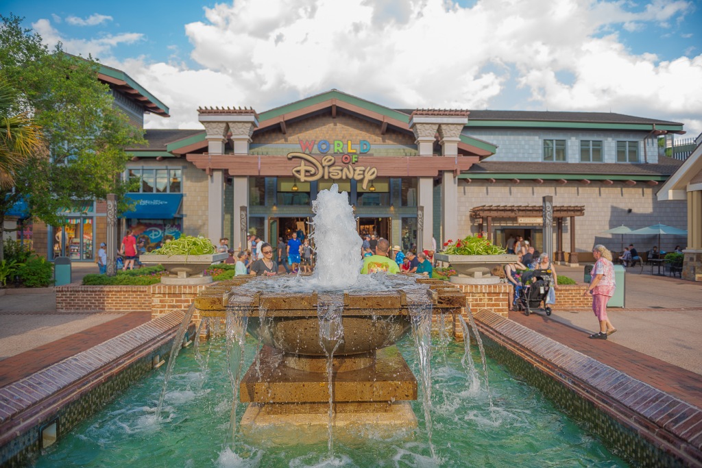 Disney Springs water fall Orlando Florida March 24, 2019 people walking around World of Disney Store